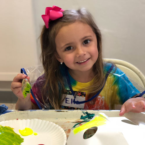 child with finger paints